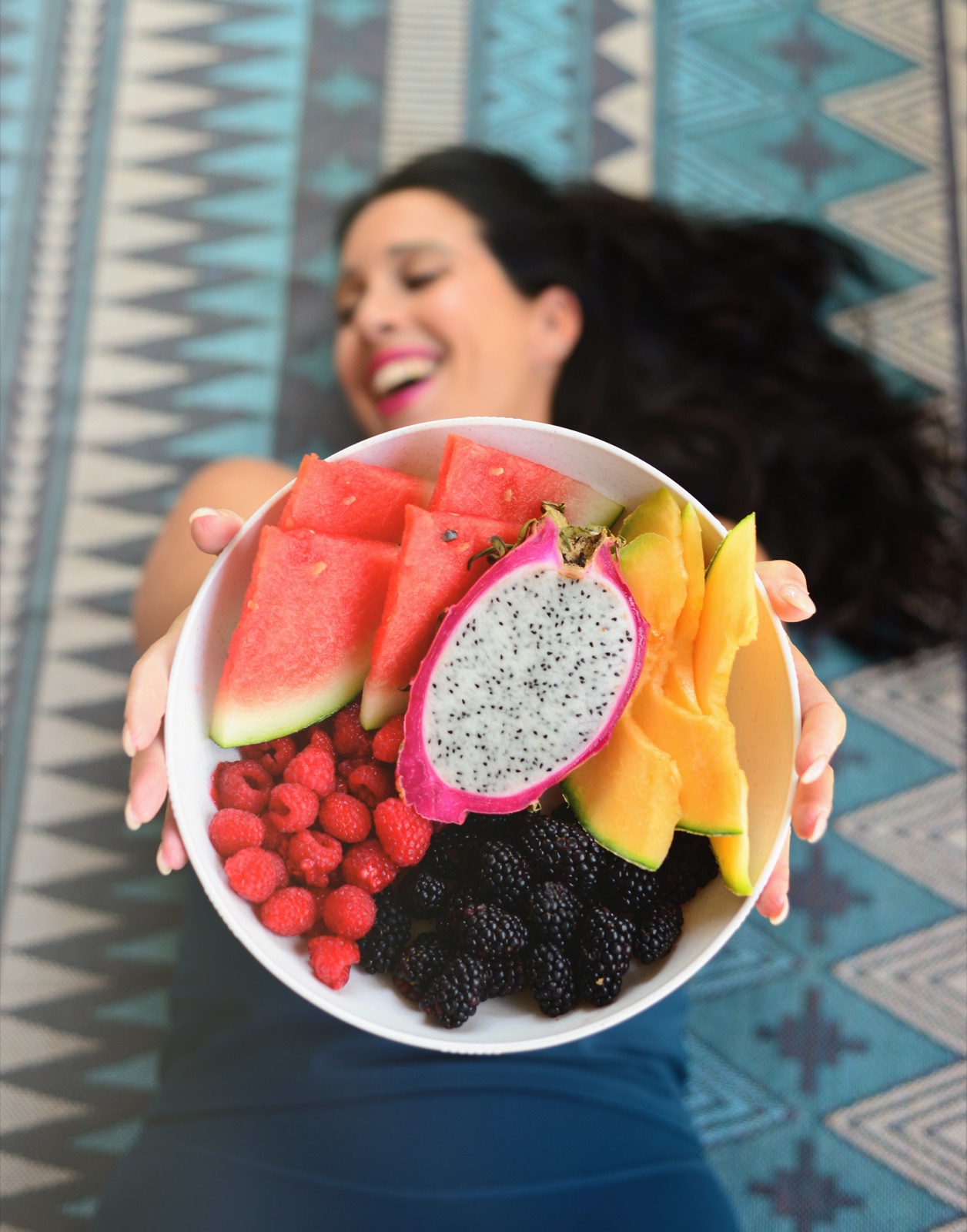 A colorful platter of watermelon, dragon fruit, mango and berries